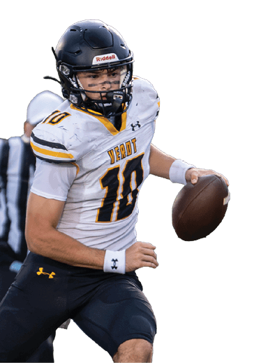 A person wearing a football uniform and helmet is running on a grassy field while holding a football. Descripci n generada con IA