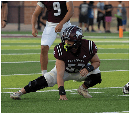 A football player running on the field. Description generated by AI