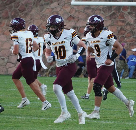 A group of football players celebrating a victory. AI generated content