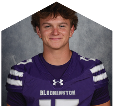 A young man wearing a white jersey with the number 0 on it. Description generated by AI