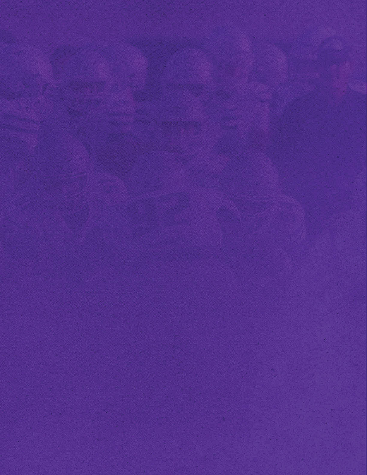 A group of people wearing helmets and sports uniforms are gathered closely together, possibly preparing for a team activity or game. Description generated by AI