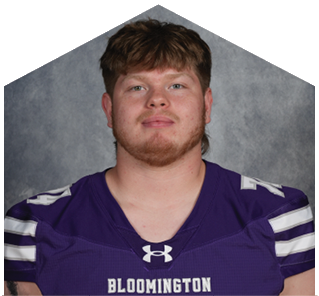 Person with short hair wearing a purple Bloomington sports jersey with white stripes on the sleeves and the number 54. Description generated by AI