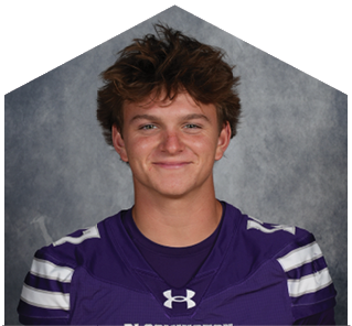 A young man wearing a white jersey with the number 0 on it. Description generated by AI