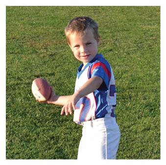 A football player wearing a blue and red jersey. Description generated by AI