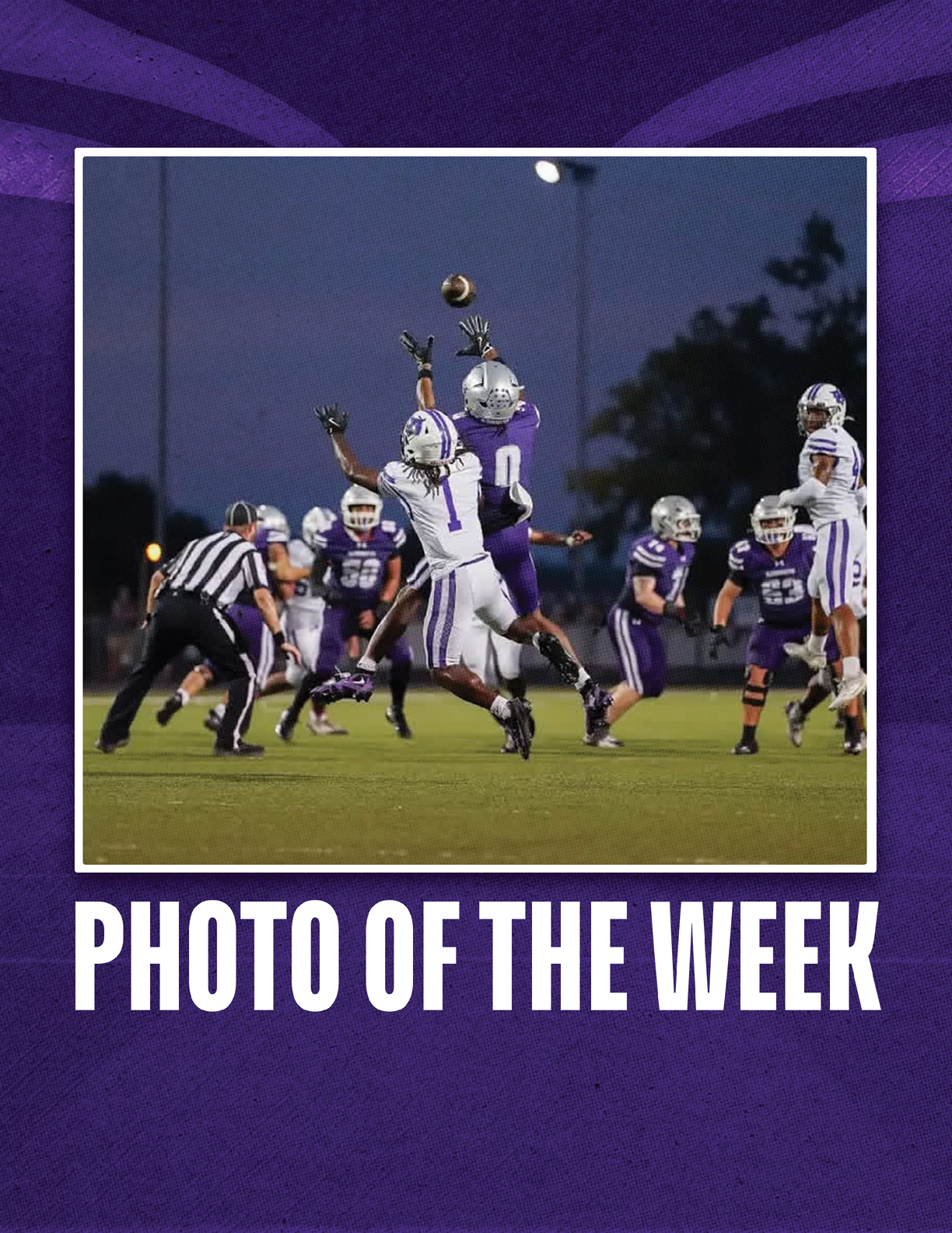 People in football uniforms are jumping and reaching for a football in midair on a field under stadium lights during a game. Description generated by AI