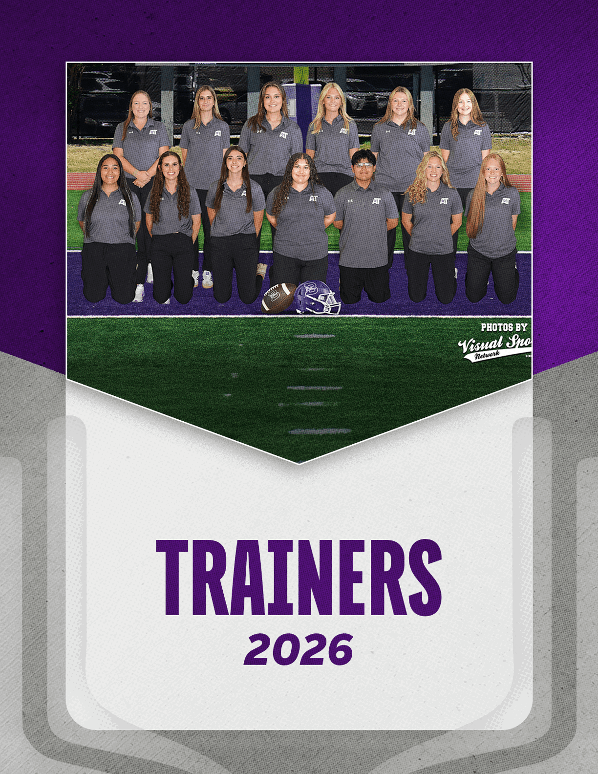 A group of adults wearing matching gray polo shirts and black pants pose on a sports field with two helmets placed in front of them above the text trainers 2026 on a purple and white background. Description generated by AI