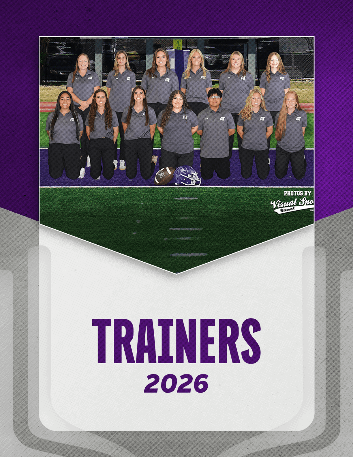 A group of adults wearing matching gray polo shirts and black pants pose on a sports field with two helmets placed in front of them above the text trainers 2026 on a purple and white background. Description generated by AI