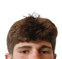 A young man wearing a white jersey with the number 10 on it. Description generated by AI