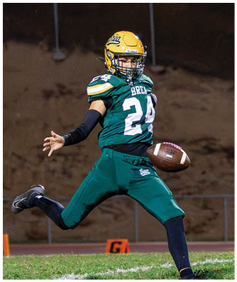 A football game is being played on a field. Description generated by AI