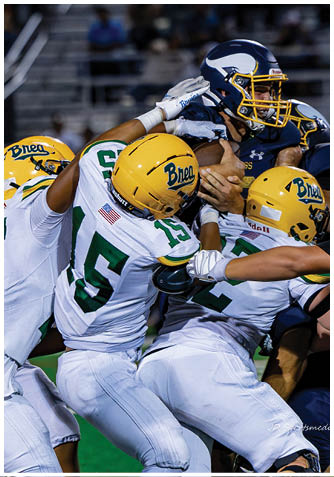 A football player wearing a blue jersey with the number 58 on it. Description generated by AI