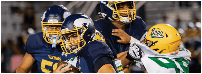 A football player is sliding on the ground. Description generated by AI
