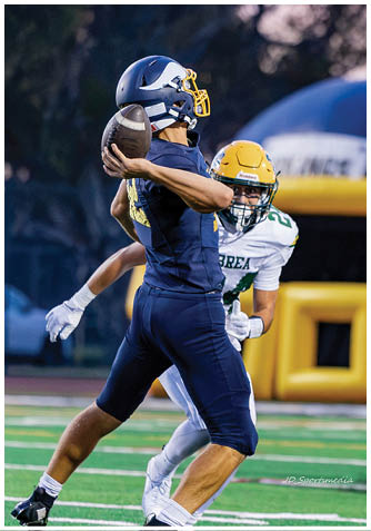 A football player wearing a blue jersey with the number 58 on it. Description generated by AI