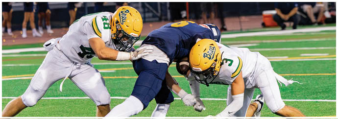 A group of football players on a field. Description generated by AI