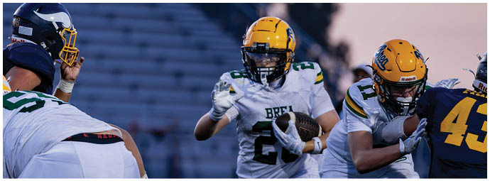 A football player is sliding on the ground. Description generated by AI