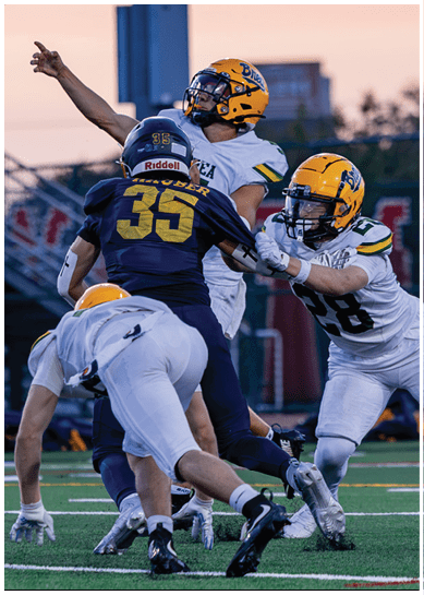 A football player wearing a blue jersey with the number 58 on it. Description generated by AI