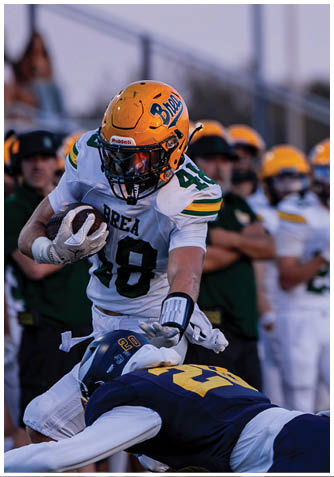 A football player wearing a blue jersey with the number 58 on it. Description generated by AI