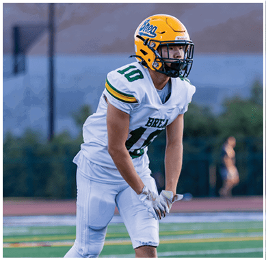 A football player running on the field. Description generated by AI