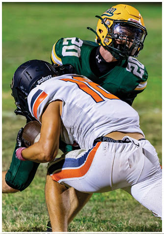 A football player wearing a blue jersey with the number 58 on it. Description generated by AI