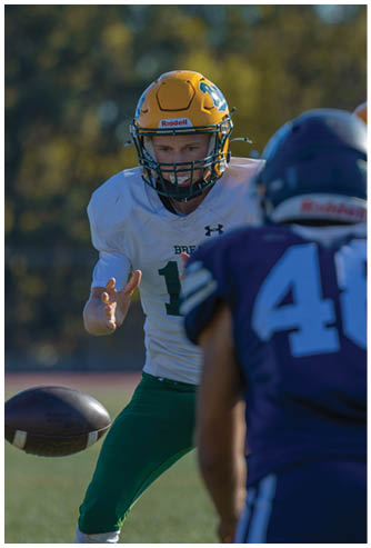 A football game is being played on a field. Description generated by AI
