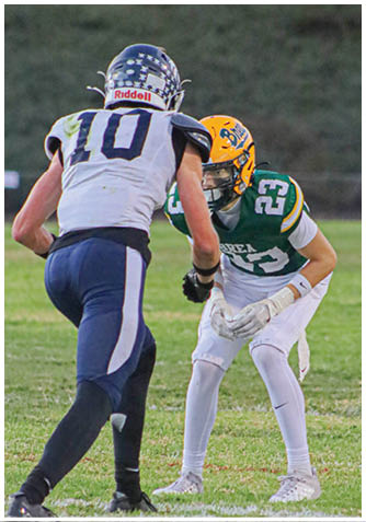 A football player wearing a blue jersey with the number 58 on it. Description generated by AI