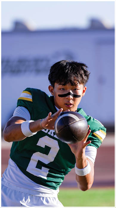 A football player running on the field. Description generated by AI
