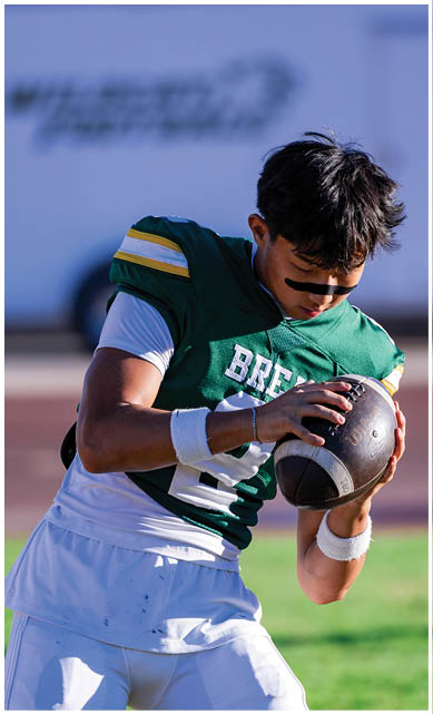 A football player wearing a blue jersey with the number 58 on it. Description generated by AI