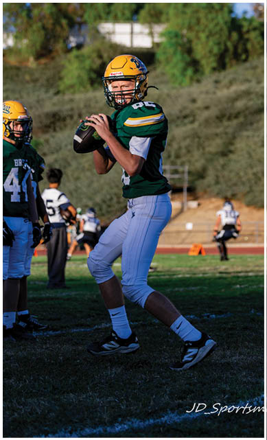 A football player wearing a blue jersey with the number 58 on it. Description generated by AI