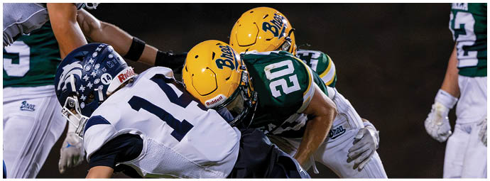 A football player is sliding on the ground. Description generated by AI