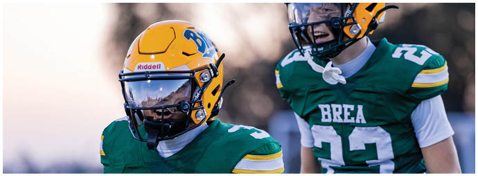 A football player is sliding on the ground. Description generated by AI