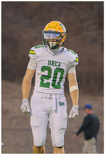 A football player running on the field. Description generated by AI