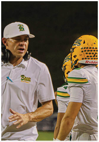 A football player wearing a blue jersey with the number 58 on it. Description generated by AI