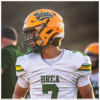 A football player running on the field. Description generated by AI