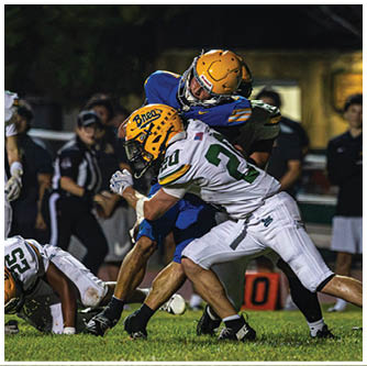 A football player running on the field. Description generated by AI