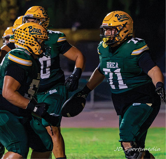 A group of football players celebrating a victory. AI generated content