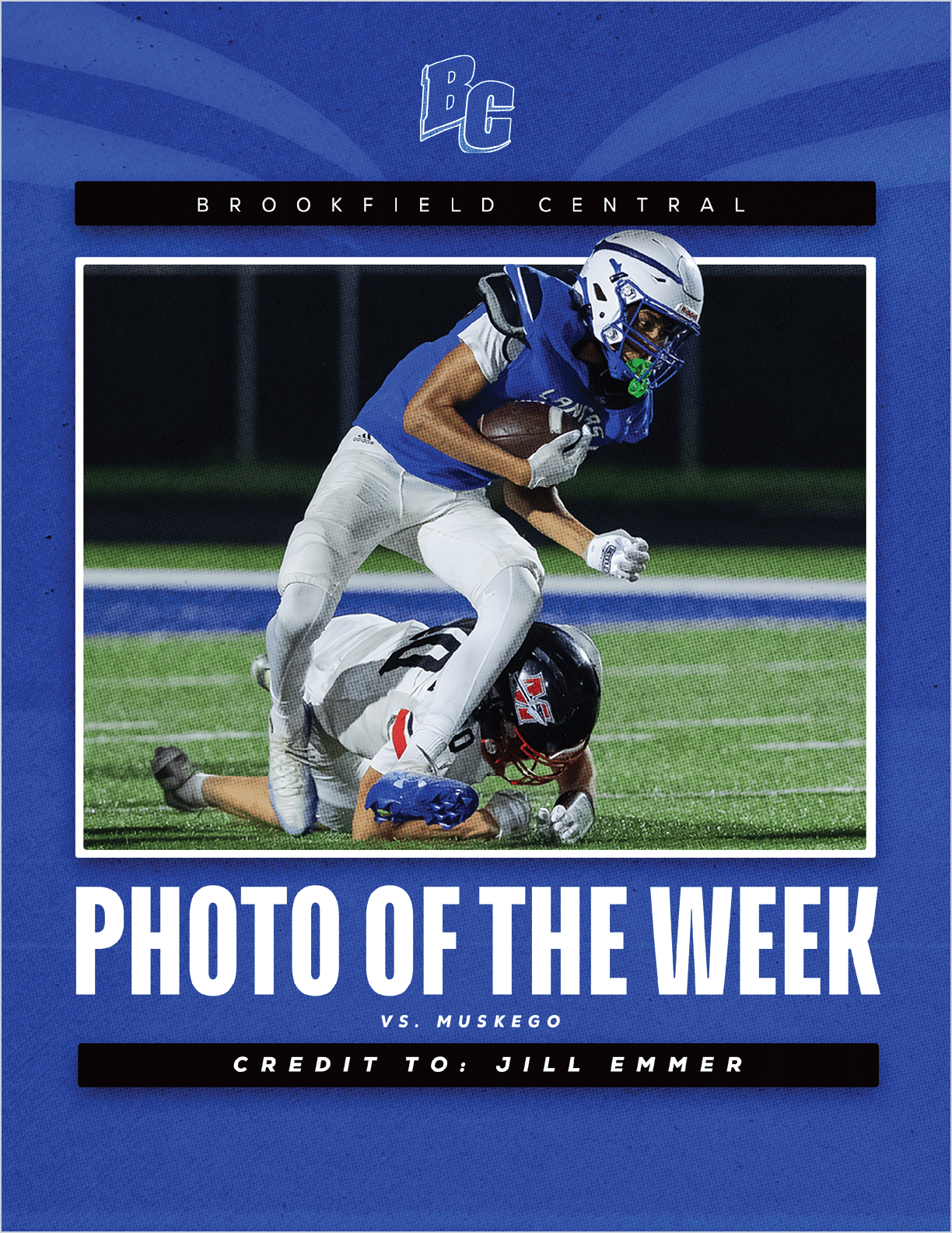 A person in a blue and white football uniform is running with the ball while stepping over another person in a black and red football uniform lying on the field during a night game. Description generated by AI
