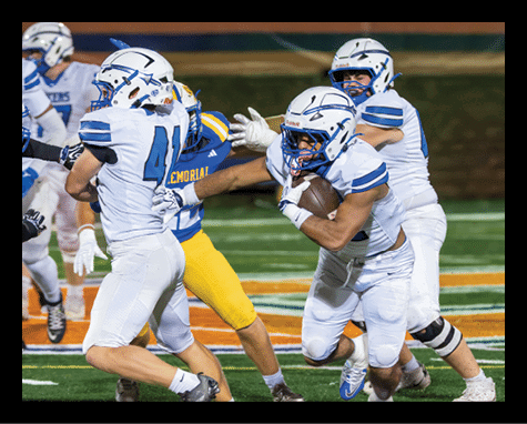 A person wearing a white sports uniform is holding a football tightly while another person in a yellow uniform is nearby on a football field. Description generated by AI