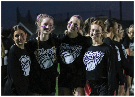 A dark background with stylized text reading “Powderpuff Juniors 2028" above a graphic of a football. Description generated by AI