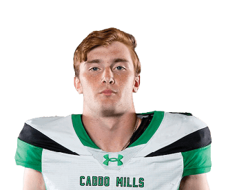 A person stands facing forward wearing a white and green sports uniform with the number four on the front against a white background. Descripci n generada con IA