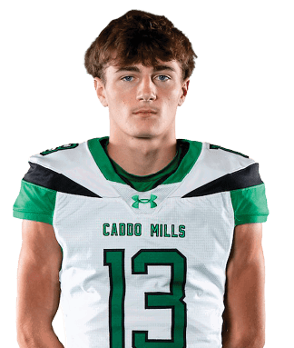A person stands facing forward wearing a green and white football uniform with the number 13 on the jersey. Descripci n generada con IA