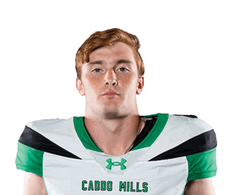 A person stands facing forward wearing a white and green sports uniform with the number four on the front against a white background. Descripci n generada con IA