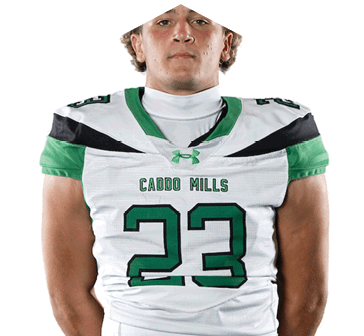 Person with curly hair wearing a white and green football jersey with the number 23 and the text “Caddo Mills" on the front. Descripci n generada con IA