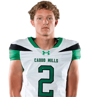 A person with curly hair stands facing forward wearing a white and green sports uniform with the number two and the words “Cairo Mules" on the jersey. Descripci n generada con IA