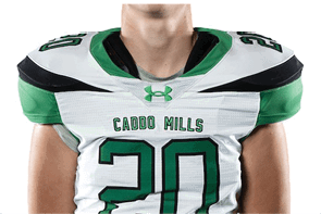 A person stands with hands behind their back wearing a white sports jersey with the number 20 and green pants with black knee-high socks. Descripci n generada con IA