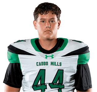 A person stands facing forward wearing a white and green sports uniform with the number 44 and the words “Cajon Hills" on the jersey. Descripci n generada con IA