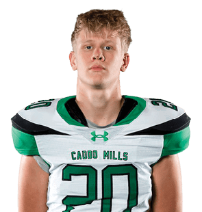 A person stands facing forward wearing a white and green sports jersey with the number 20 and green pants, with hands behind their back against a white background. Descripci n generada con IA