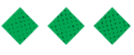 Three green diamond shapes with a pattern of small black dots evenly distributed across their surfaces. Descripci n generada con IA