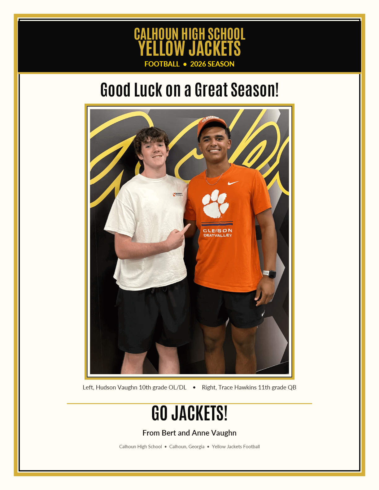 Two adults stand side by side smiling with one wearing a white shirt and black shorts and the other wearing an orange Clemson football shirt and black shorts in a framed poster wishing good luck for the Calhoun High School Yellow Jackets football 2026 season. Description generated by AI