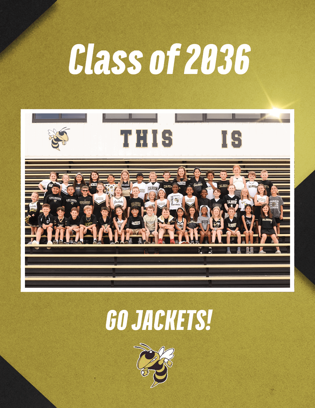 A group of children wearing black and white sportswear are seated on bleachers in a gymnasium with the words “THIS IS" on the wall behind them and text above and below the photo reading "Class of 2036" and "GO JACKETS!" with a yellow jacket mascot. Description generated by AI
