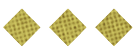 Three golden diamond-shaped waffle pieces are arranged in a horizontal row on a white background. Description generated by AI