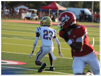 A football player is sliding on the ground. Description generated by AI